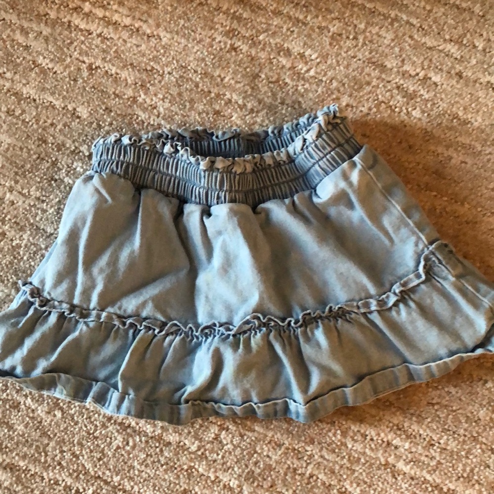 Blue mini bubble skirt with ruffled and smocked details for casual occasions